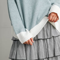 Blue and Ivory sweater with contrast ribbed cuff and hem, close-up detail