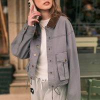 Denim Blue cropped utility jacket styled outdoors, front view