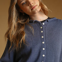 Nightfall knit cardigan with contrast buttons, close-up front detail