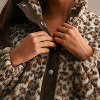 Leopard sherpa funnel collar and contrast placket, close-up