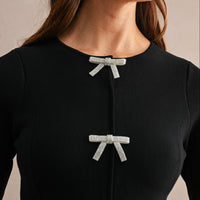 Jewel Bow Peplum Knit Top