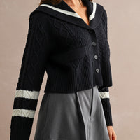 Women's navy sailor collar cable knit cardigan with button front and contrast ivory sleeve stripes