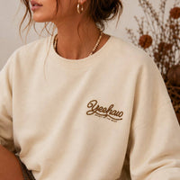 Front view of the AFTERGLOW western sweatshirt on a model with the small Yeehaw Spirit of the West graphic