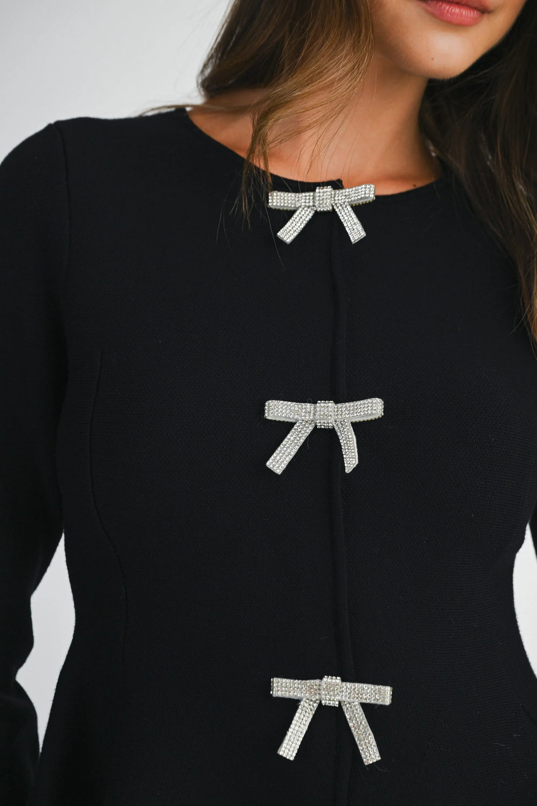 Jewel Bow Peplum Knit Top