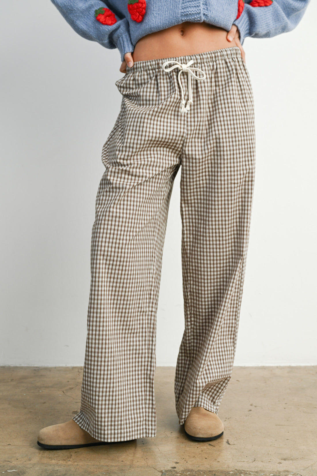 Brown check drawstring pants with relaxed wide leg fit