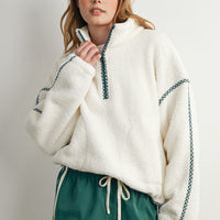 Women's oversized cream sherpa fleece half zip pullover with green gingham trim and stand collar