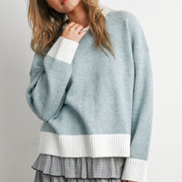 Blue and Ivory relaxed crew neck knit sweater, angled front view