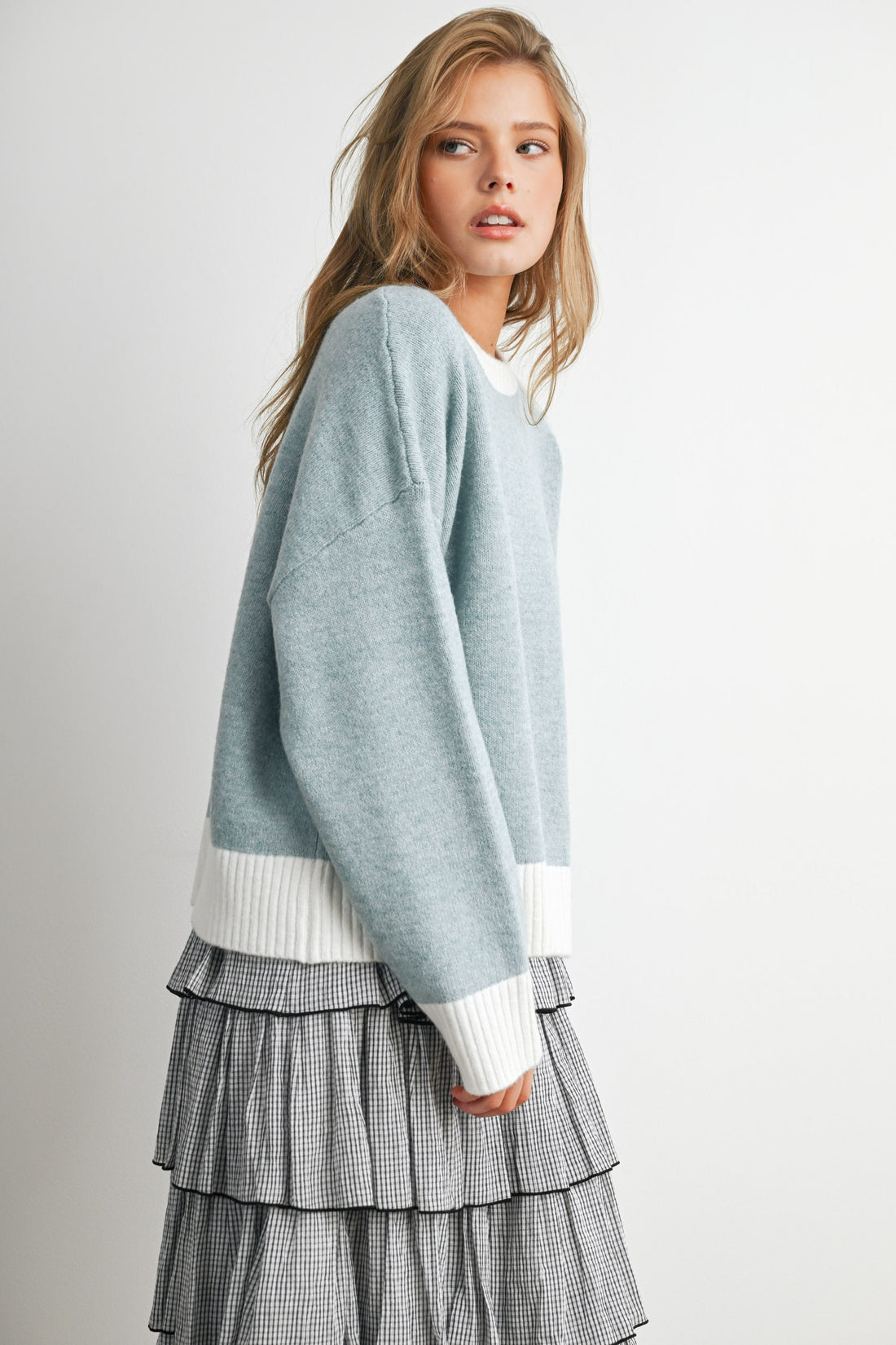 Blue and Ivory contrast-trim knit sweater, side view on model