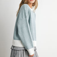Blue and Ivory contrast-trim knit sweater, side view on model