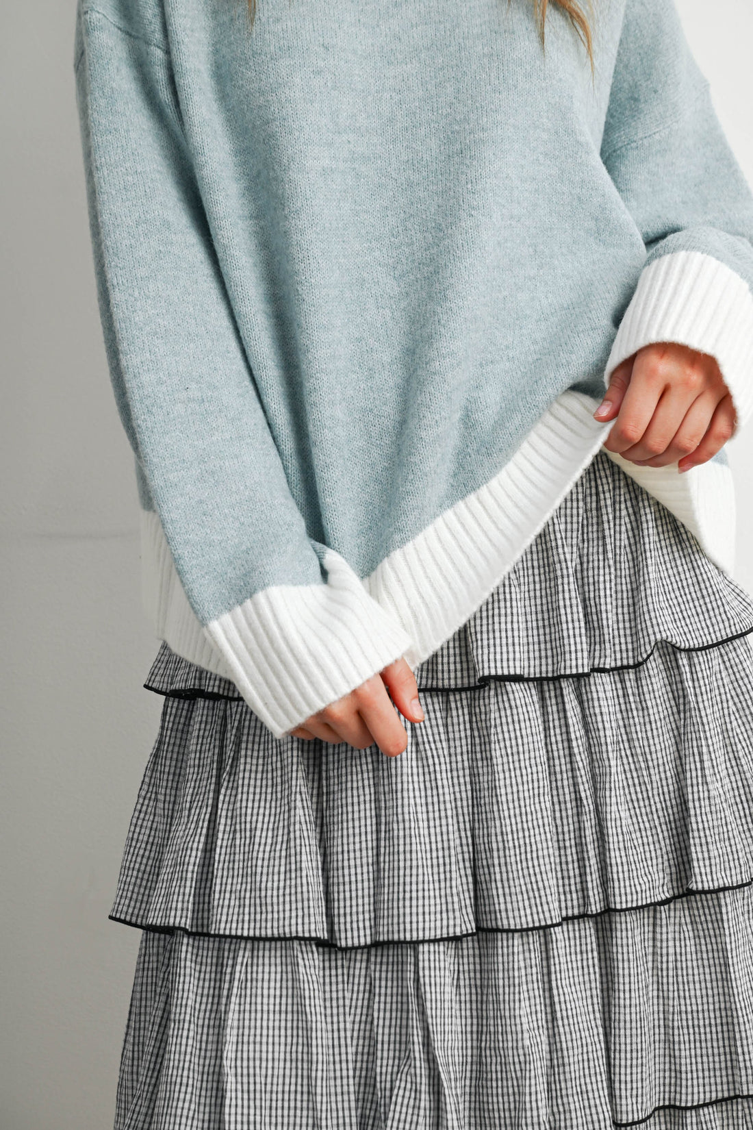 Blue and Ivory sweater with contrast ribbed cuff and hem, close-up detail