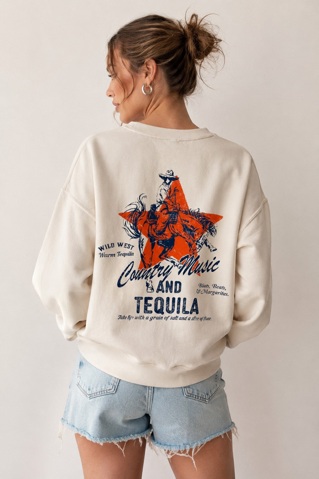 Country music and tequila western sweatshirt, back view on model