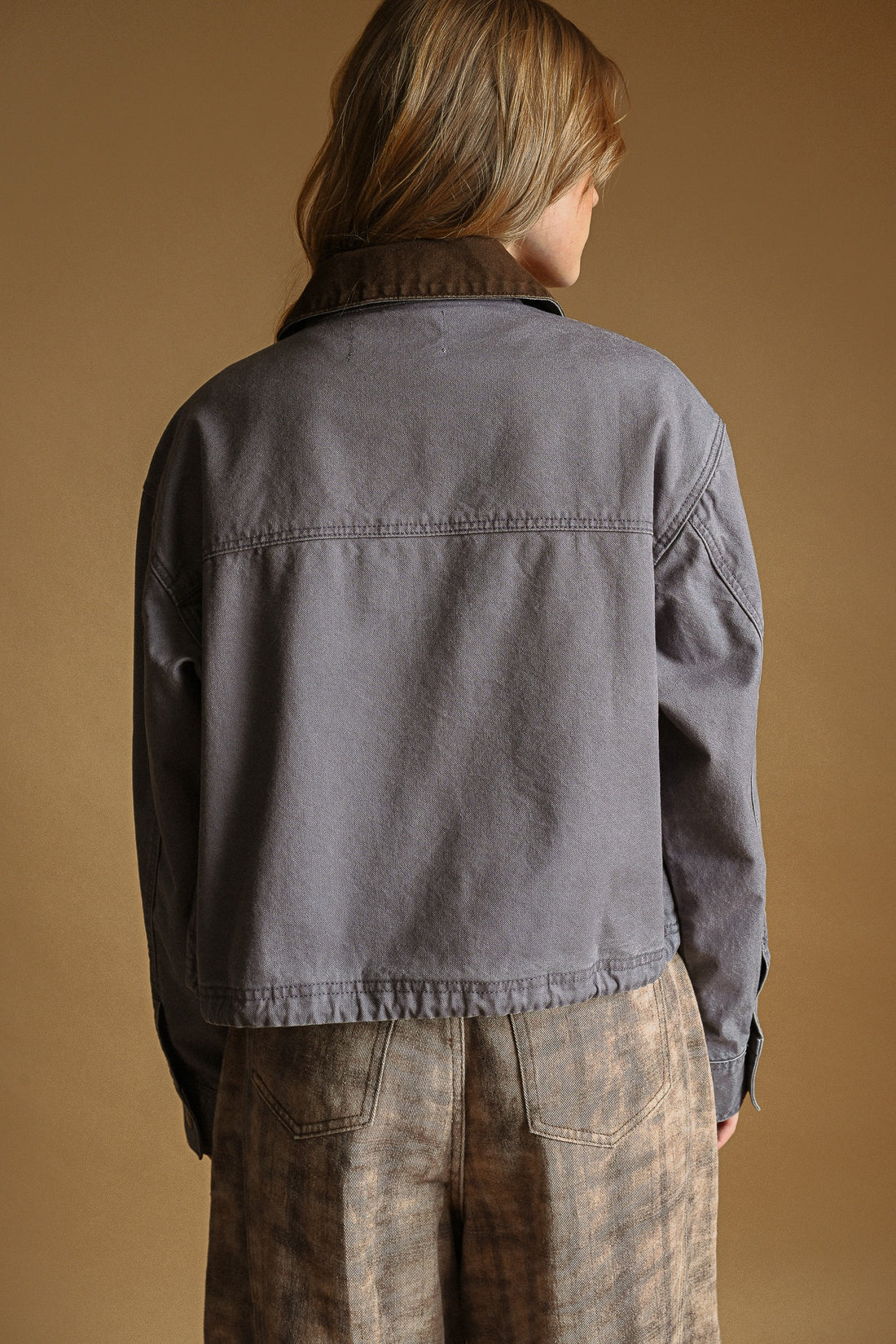 Denim Blue cropped utility jacket, back view on model