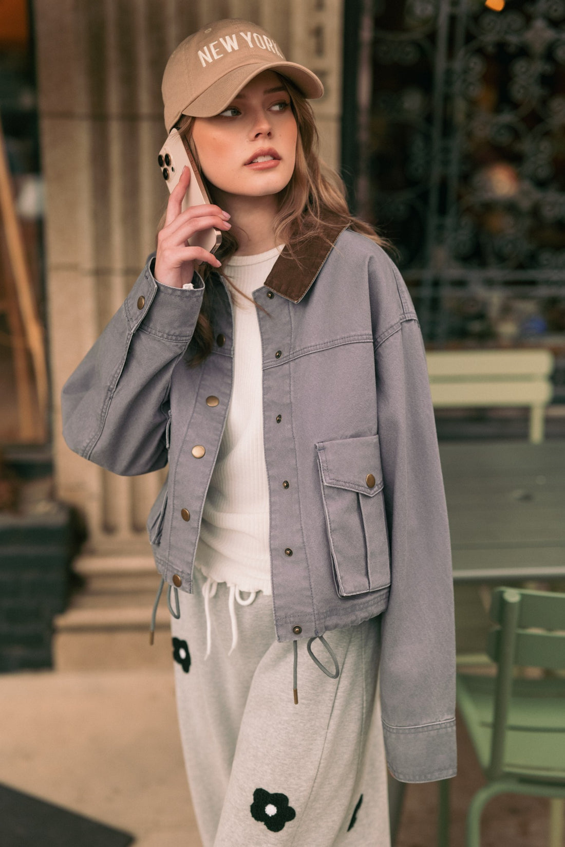 Denim Blue cropped utility jacket styled outdoors, front view