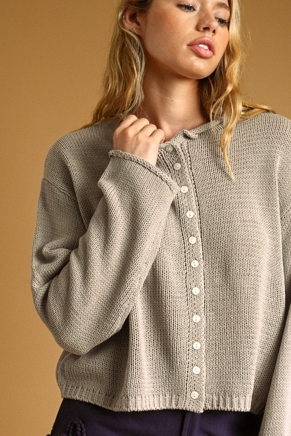Aurora Grey knit cardigan with contrast buttons, close-up front detail