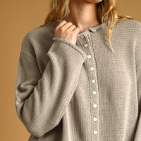 Aurora Grey knit cardigan with contrast buttons, close-up front detail