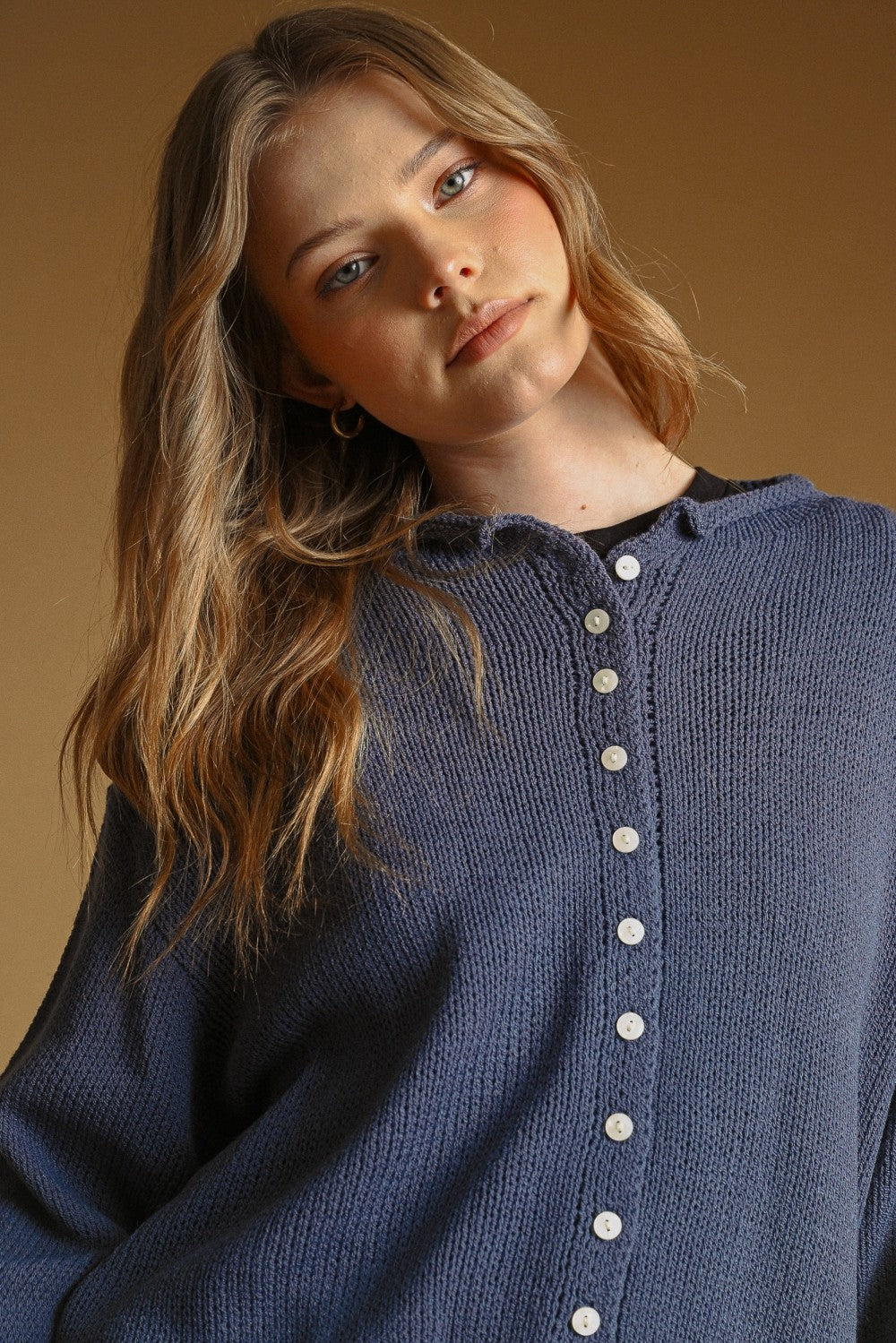 Nightfall knit cardigan with contrast buttons, close-up front detail