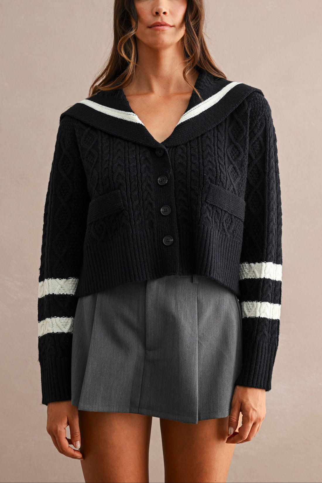 Women's navy sailor collar cable knit cardigan with button front and contrast ivory sleeve stripes