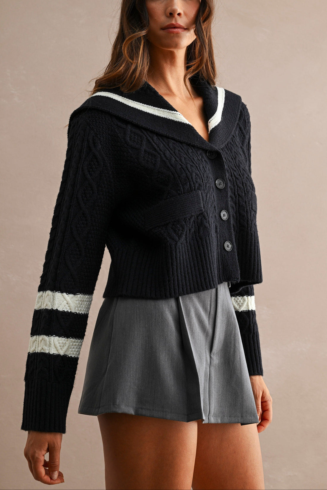 Women's navy sailor collar cable knit cardigan with button front and contrast ivory sleeve stripes