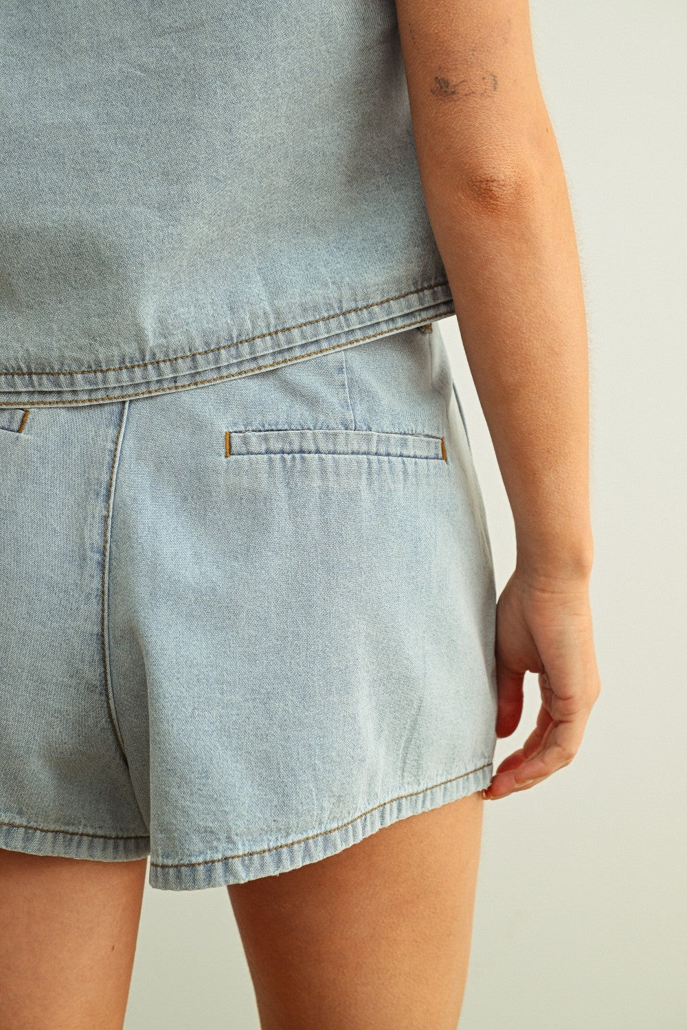 Women’s Light Wash Denim Pleated Shorts