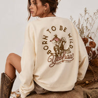 Back view of the AFTERGLOW Born To Be Wild sweatshirt on a model, showing the cowboy and horseback graphic